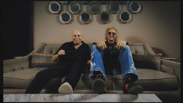 MATT PINFIELD MATT SORUM WITH FEET ON COFFEE TABLE